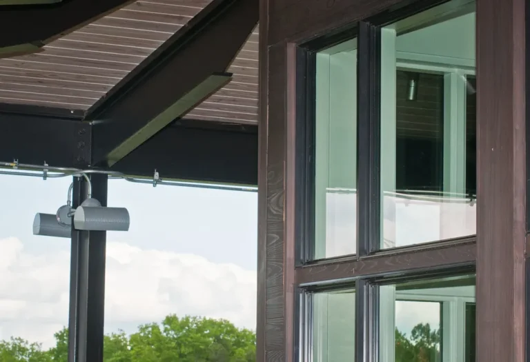 Large glass windows on the corner of a modern building seen from inside