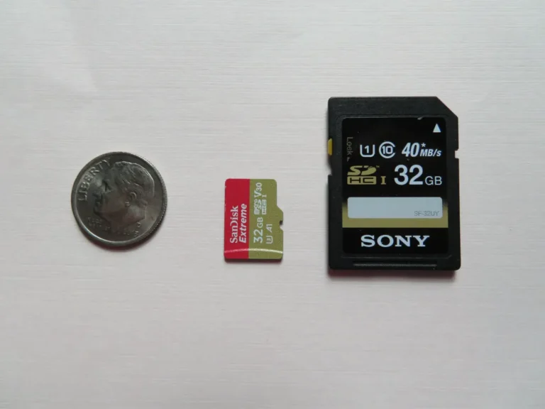 SD card, microSD card and a dime side by side for size comparison