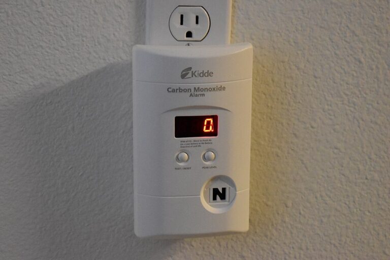 Plug-in carbon monoxide detector with a digital display on a wall outlet